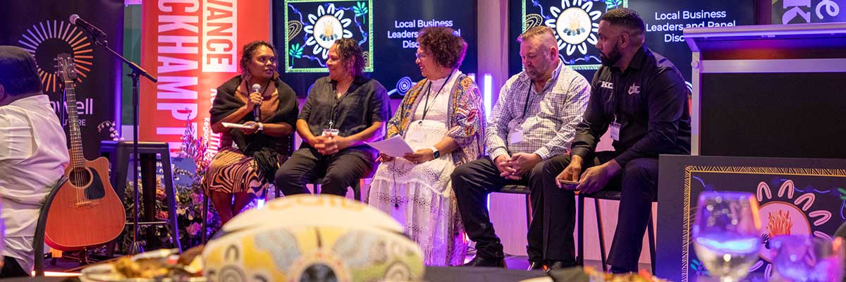 Five Indigenous business leaders discuss their work seated on a stage