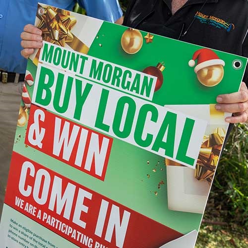 A close up shot of a banner promoting the Mount Morgan Buy Local campaign